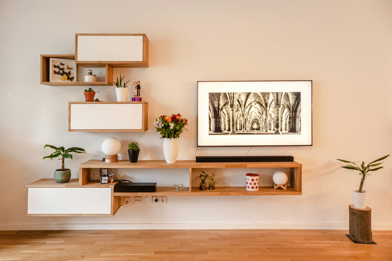 A quiet corner shelf and print wall in the Copenhagen studio